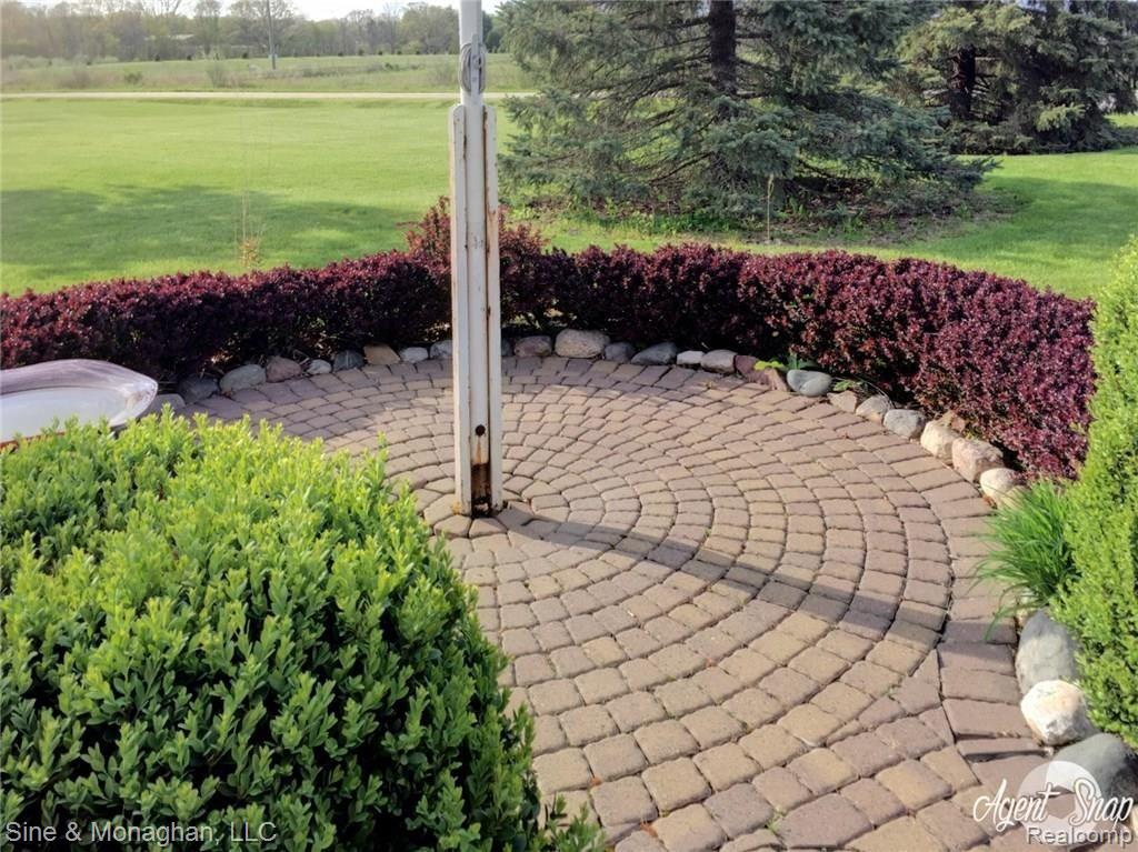 10479 Carroll Road Columbus, MI 48063 - Photo 45 of 52 Brick paver patio around flagpole