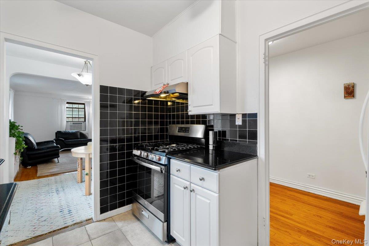 190 Garth Road, Unit 3R Scarsdale, NY 10583 - Photo 13 of 31 a kitchen with a stove and a refrigerator