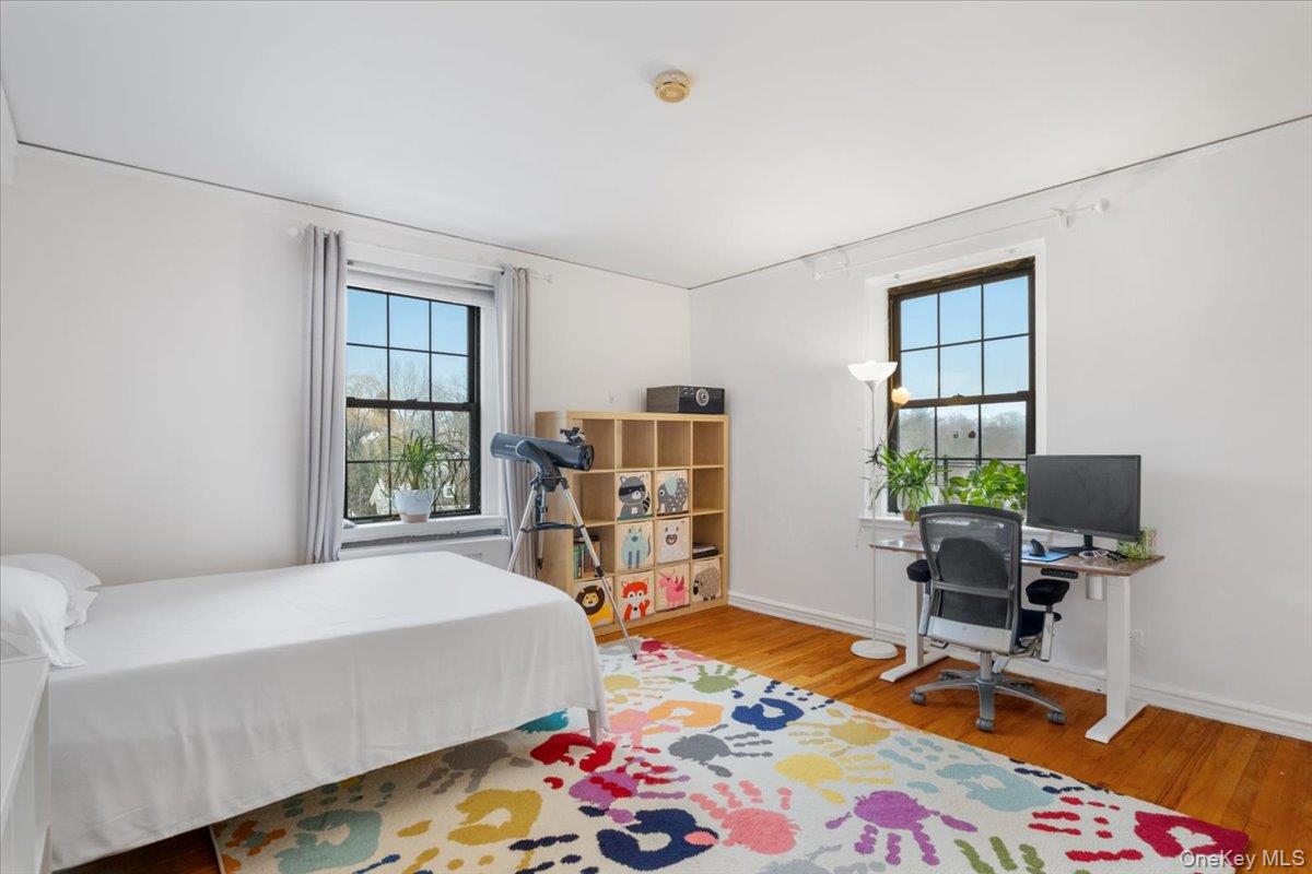 190 Garth Road, Unit 3R Scarsdale, NY 10583 - Photo 18 of 31 a bedroom with a bed and a window