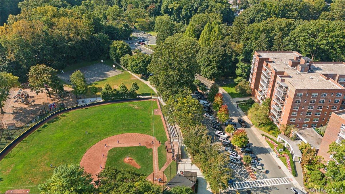 190 Garth Road, Unit 3R Scarsdale, NY 10583 - Photo 24 of 31 an aerial view of a residential houses with outdoor space and trees all around