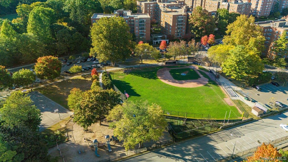 190 Garth Road, Unit 3R Scarsdale, NY 10583 - Photo 25 of 31 an aerial view of a residential houses with yard and swimming pool
