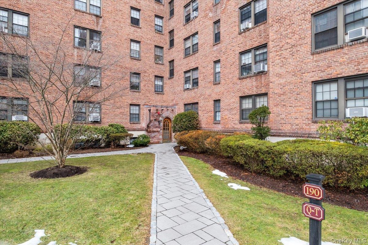 190 Garth Road, Unit 3R Scarsdale, NY 10583 - Photo 30 of 31 a front view of a building with garden