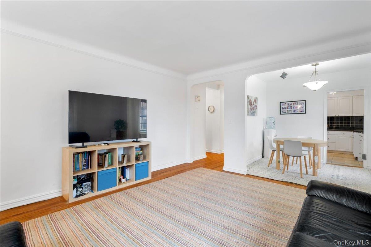 190 Garth Road, Unit 3R Scarsdale, NY 10583 - Photo 7 of 31 a living room with furniture and a flat screen tv