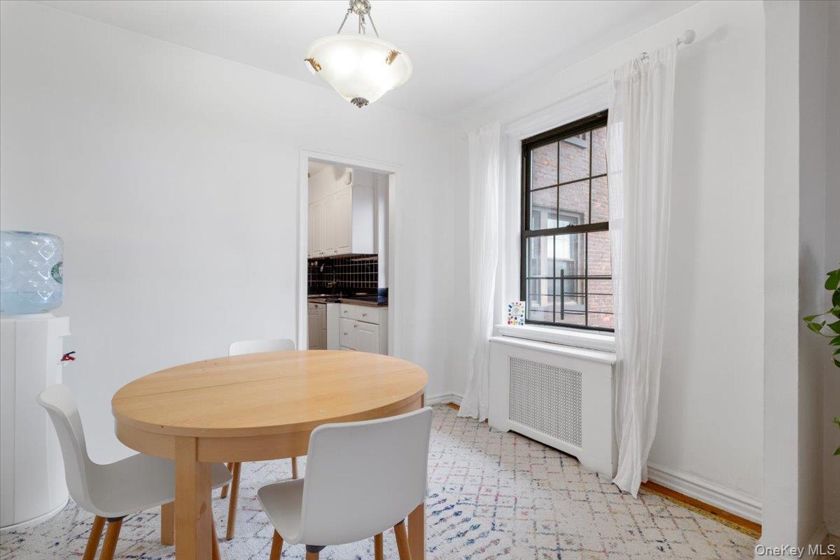190 Garth Road, Unit 3R Scarsdale, NY 10583 - Photo 9 of 31 a view of a dining room with furniture
