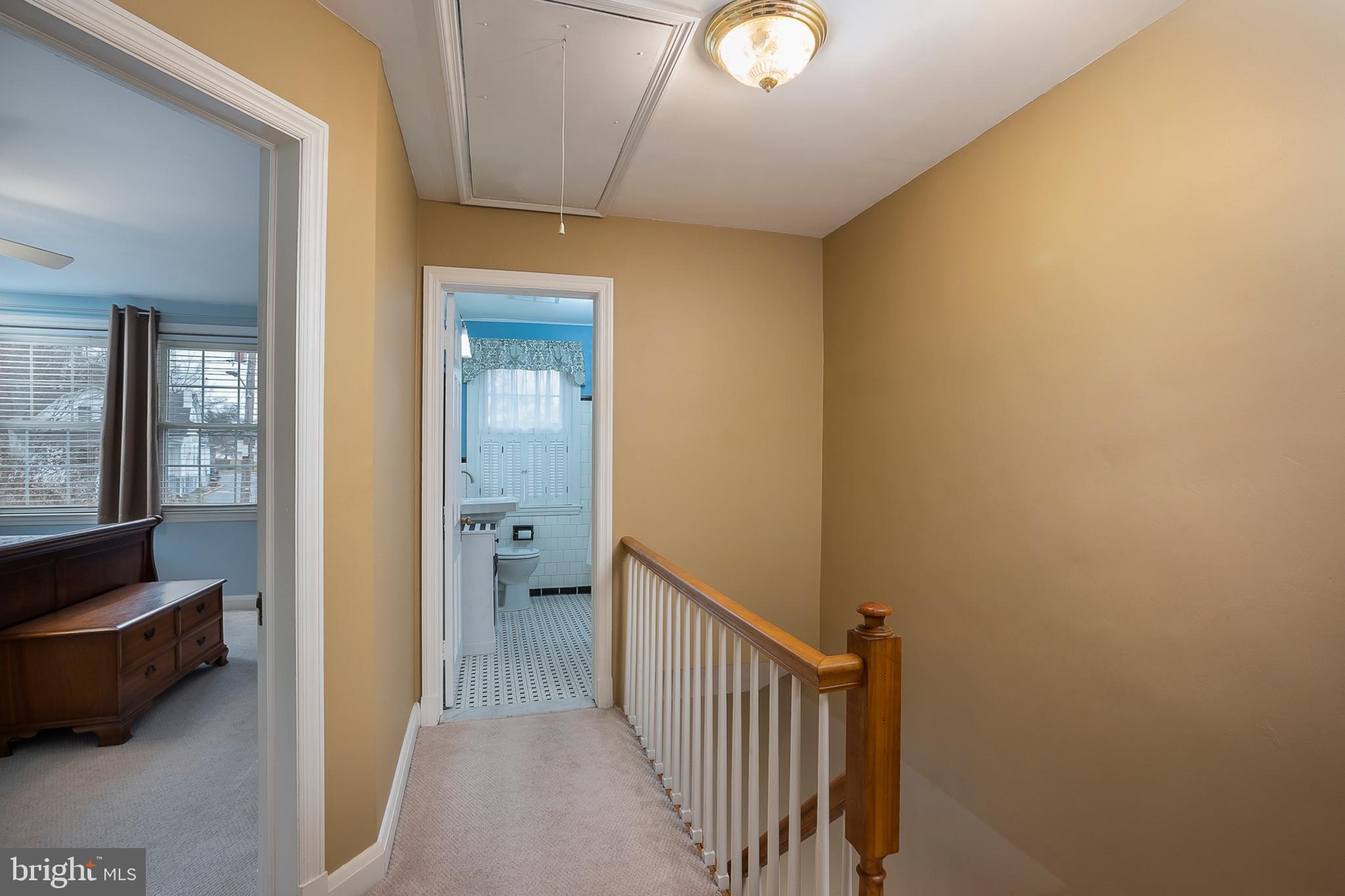 504 Academy Road Catonsville, MD 21228 - Photo 12 of 27 Upstairs landing with pull down hatch to ttic