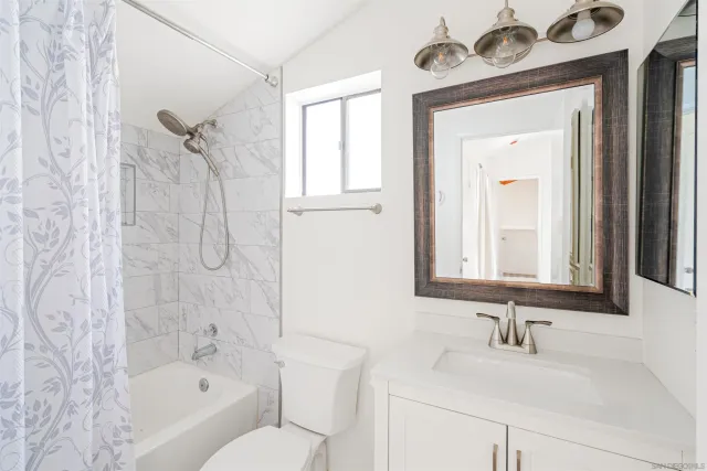 a bathroom with a sink a toilet and a bathtub