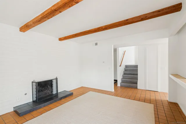 a bedroom with a bed and a television