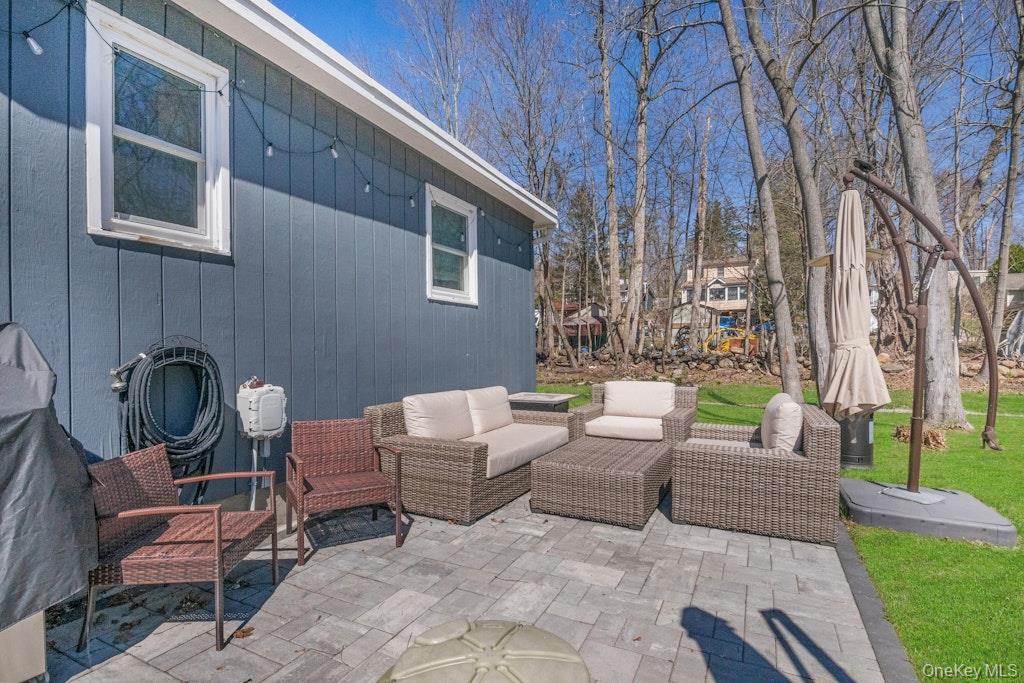 10 Locust Road Brewster, NY 10509 - Photo 13 of 21 a view of a patio with couches and a fire pit