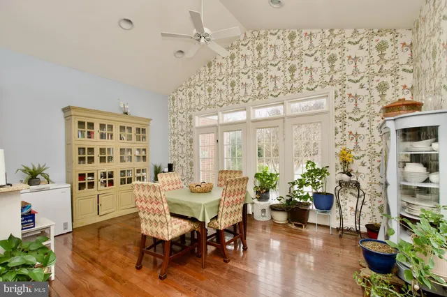 a bedroom with a bed couch and dresser