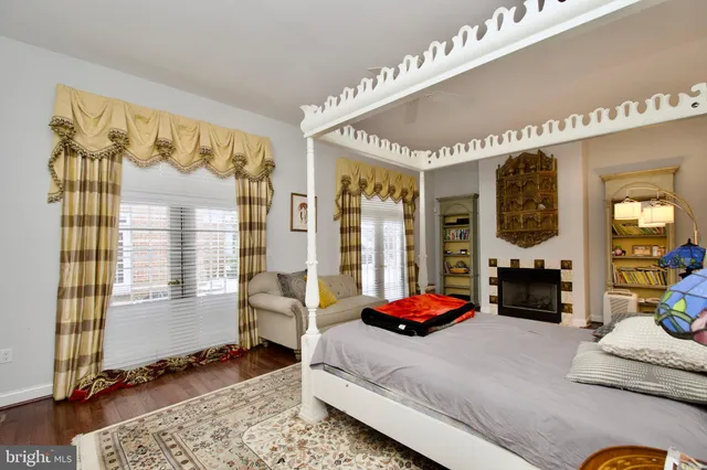 a view of walk in closet with clothes