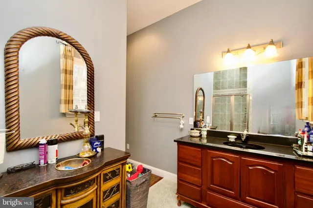 a bed room with furniture and a flat screen tv