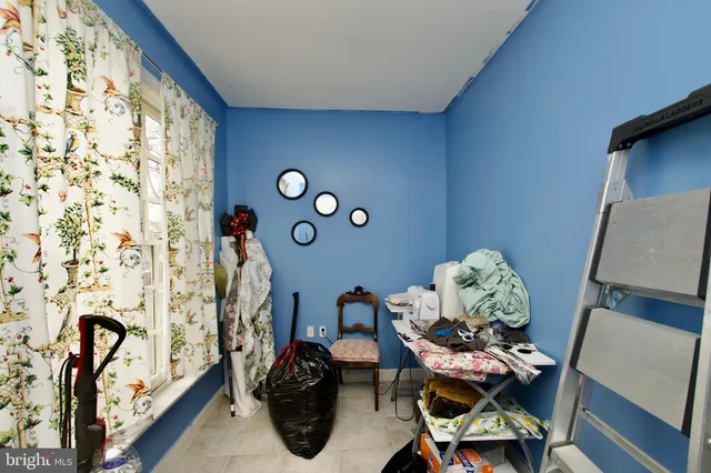 a view of a hallway with wooden floor and stairs