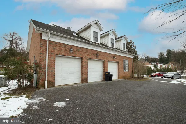 a view of a patio with table and chairs potted plants with wooden floor and fence