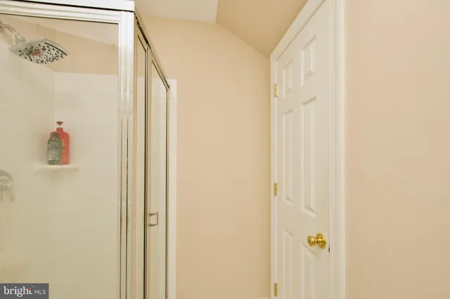 a bedroom with a bed furniture and a flat screen tv