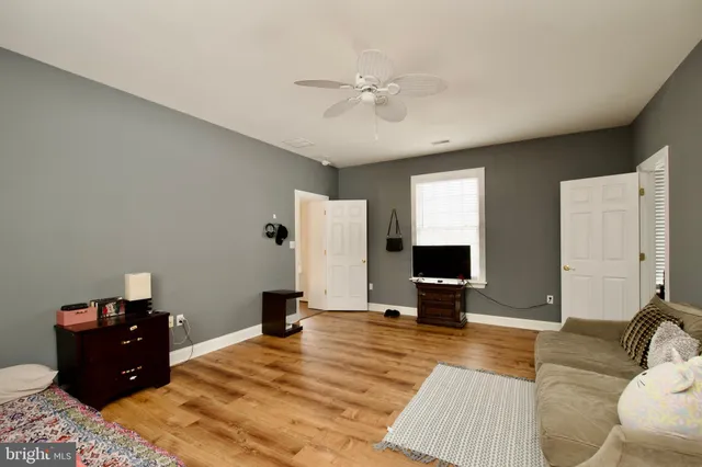 a bedroom with furniture and a window