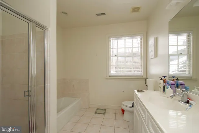 a view of a house with snow in front of house
