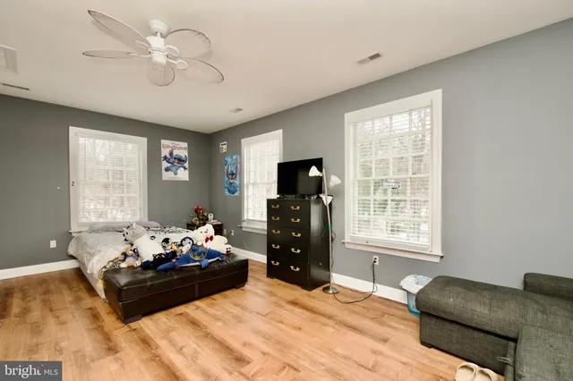 a view of a yard with snow on the road