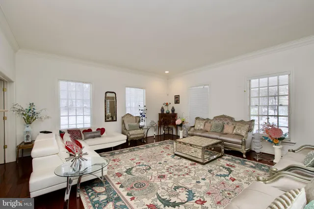 a room with furniture a rug and a fireplace