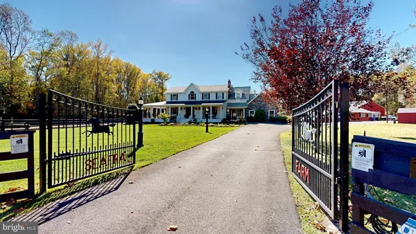 a view of a park with iron fence