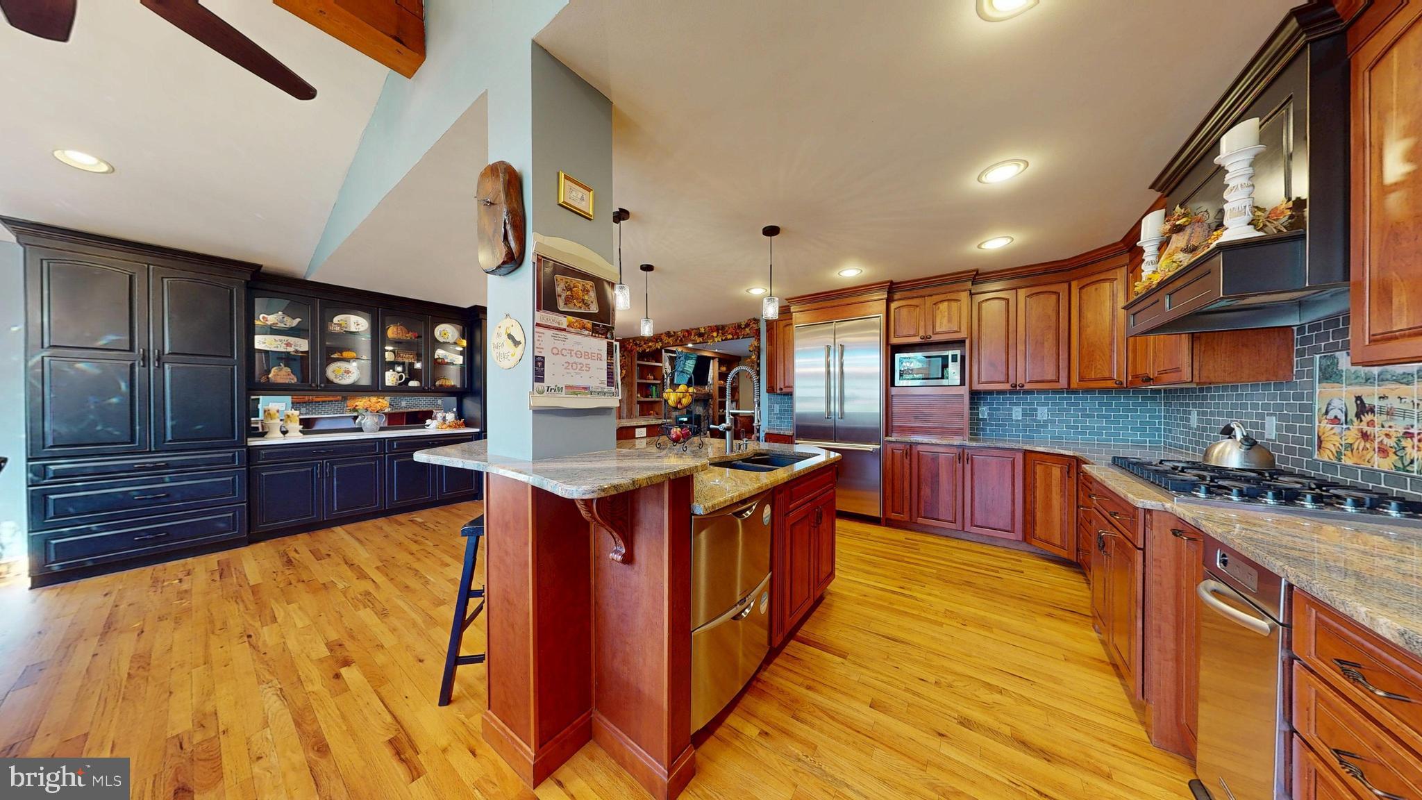 40 Cooper Tomlinson Road Medford, NJ 08055 - Photo 27 of 96 a large kitchen with stainless steel appliances granite countertop a stove and a wooden cabinets