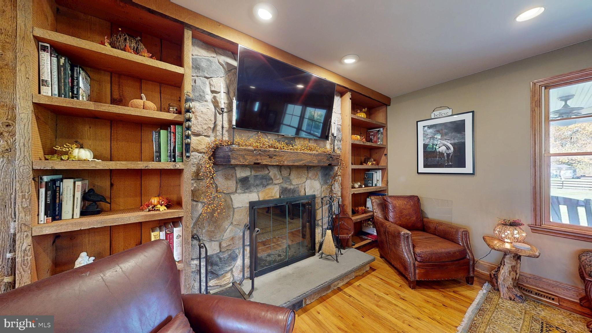 40 Cooper Tomlinson Road Medford, NJ 08055 - Photo 39 of 96 a living room with furniture and a fireplace