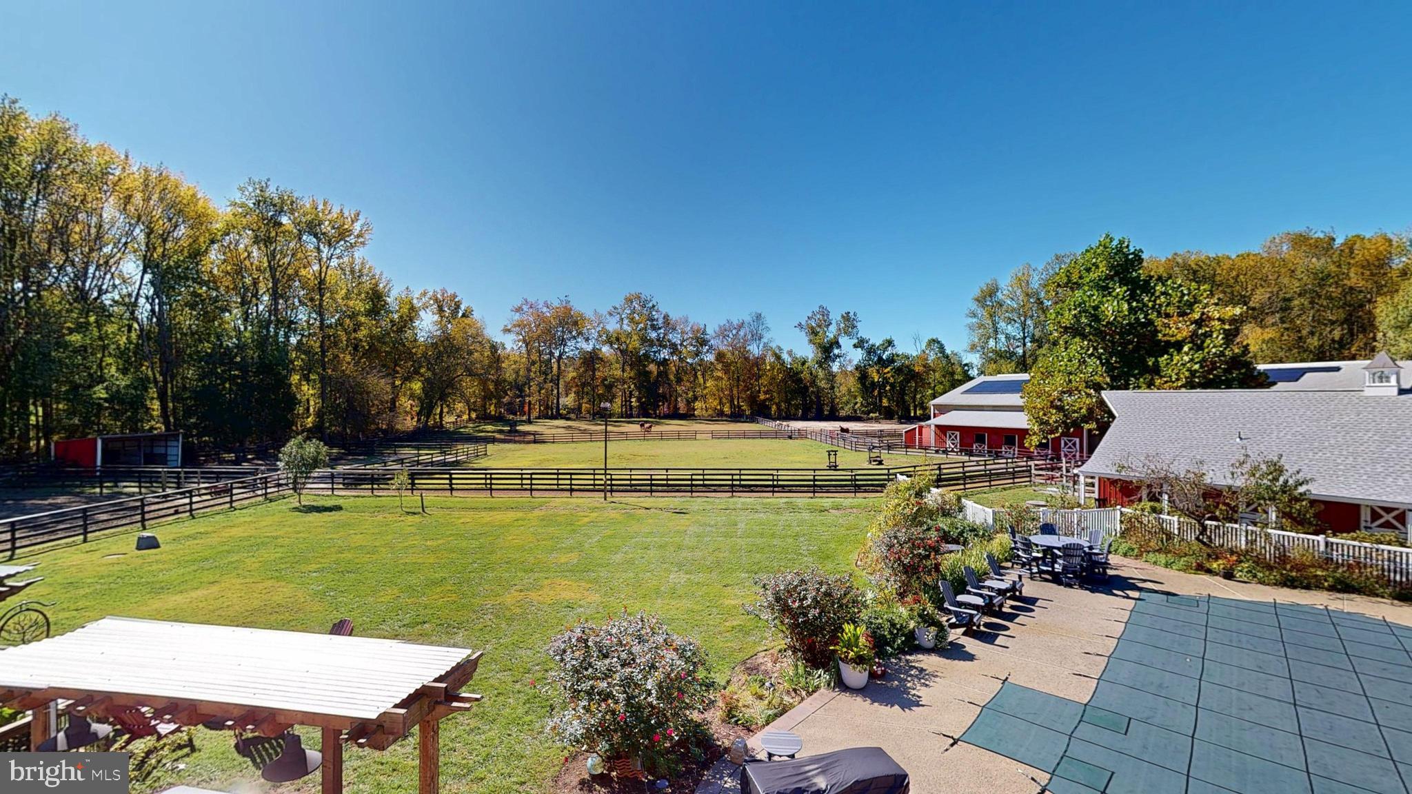 40 Cooper Tomlinson Road Medford, NJ 08055 - Photo 10 of 96 a view of a swimming pool with a patio and a garden