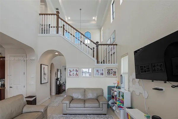 a living room with furniture and a flat screen tv