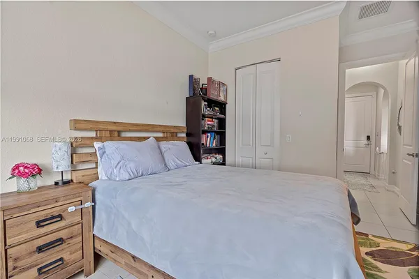 a bedroom with a bed and a closet