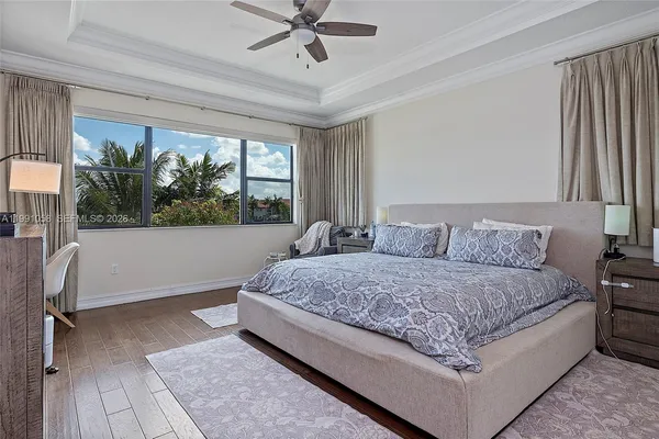 a living room with a bed furniture and a window