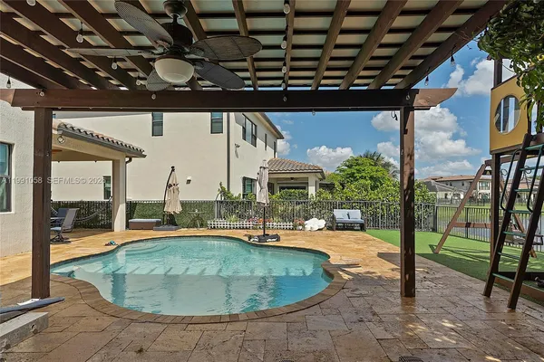 a view of a swimming pool with a patio