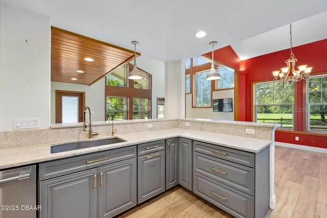 a kitchen with a sink stove and cabinets