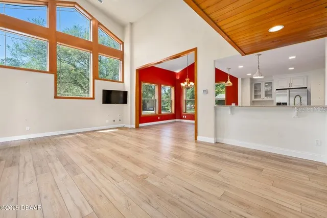 a view of a living room and entry way