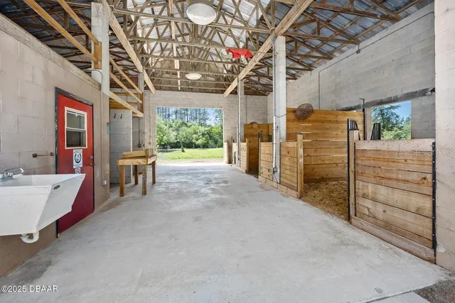 a view of a brick wall with glass door and porch