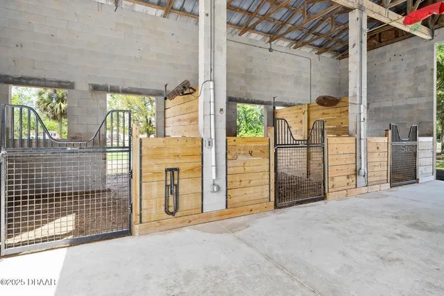 an empty room with large windows