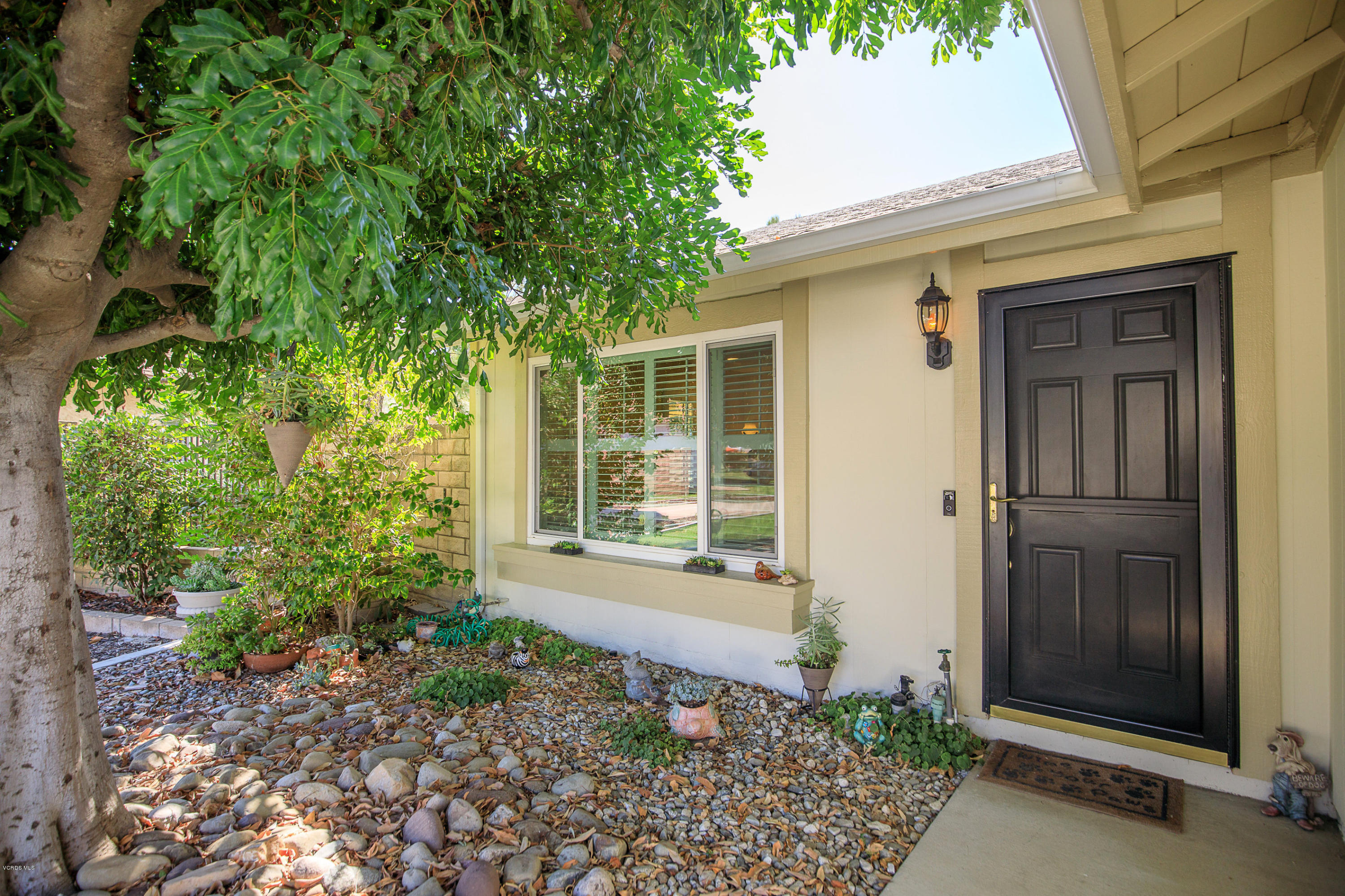 13208 East Quail Summit Road Moorpark, CA 93021 - Photo 2 of 36 a front view of a house with a yard