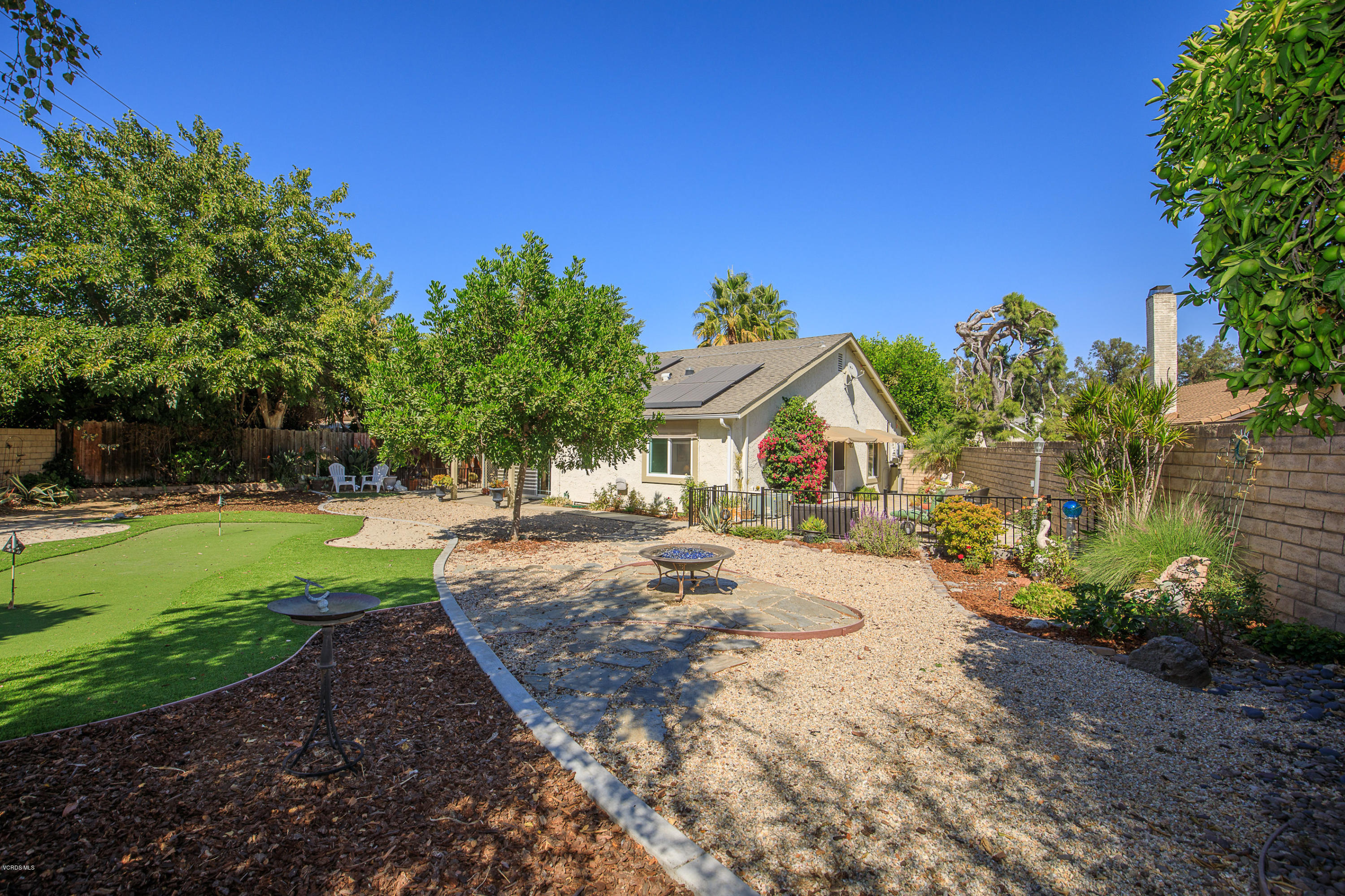 13208 East Quail Summit Road Moorpark, CA 93021 - Photo 23 of 36 a view of a house with a yard and tree s