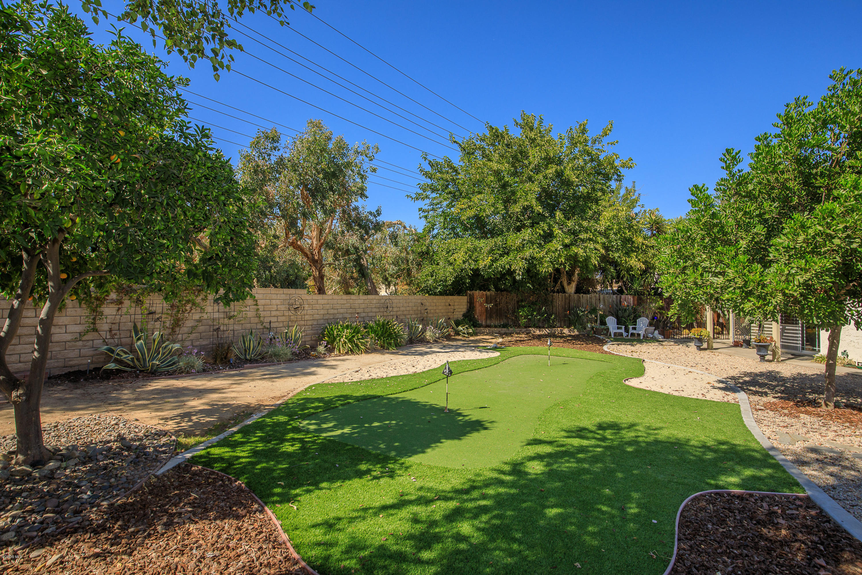 13208 East Quail Summit Road Moorpark, CA 93021 - Photo 24 of 36 a view of a backyard with a garden