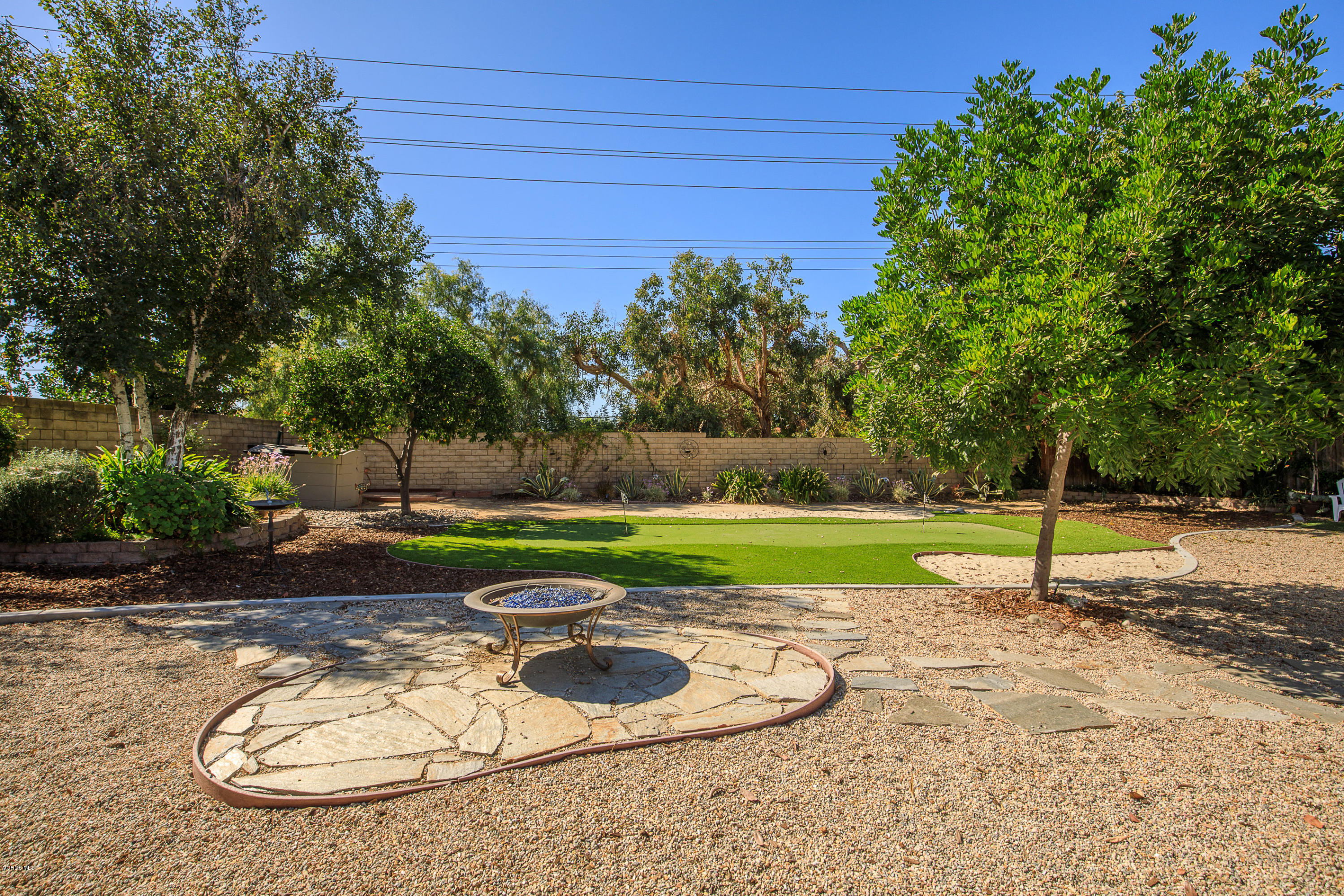 13208 East Quail Summit Road Moorpark, CA 93021 - Photo 25 of 36 a view of a backyard with a slide