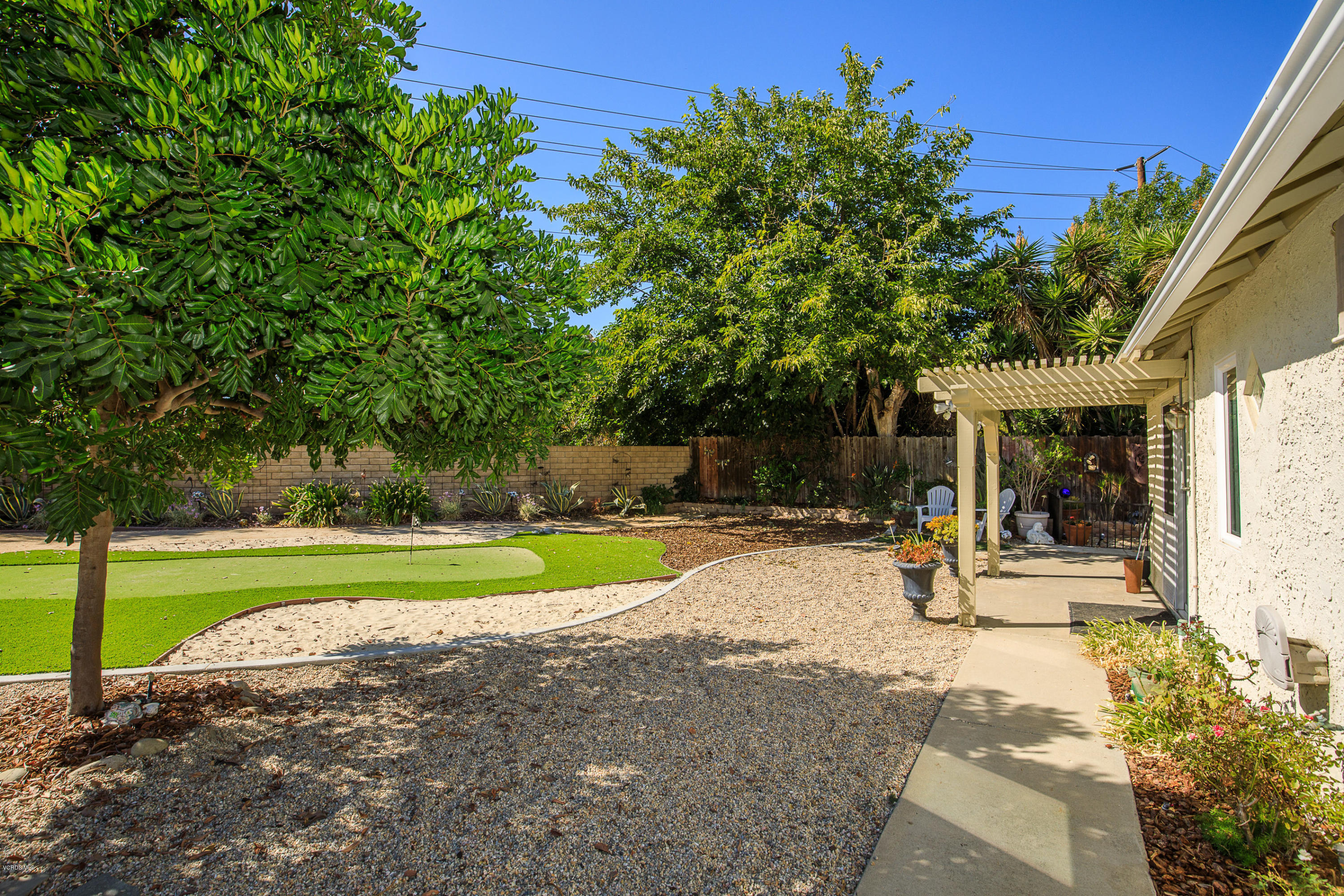 13208 East Quail Summit Road Moorpark, CA 93021 - Photo 27 of 36 a view of a house with backyard and a tree