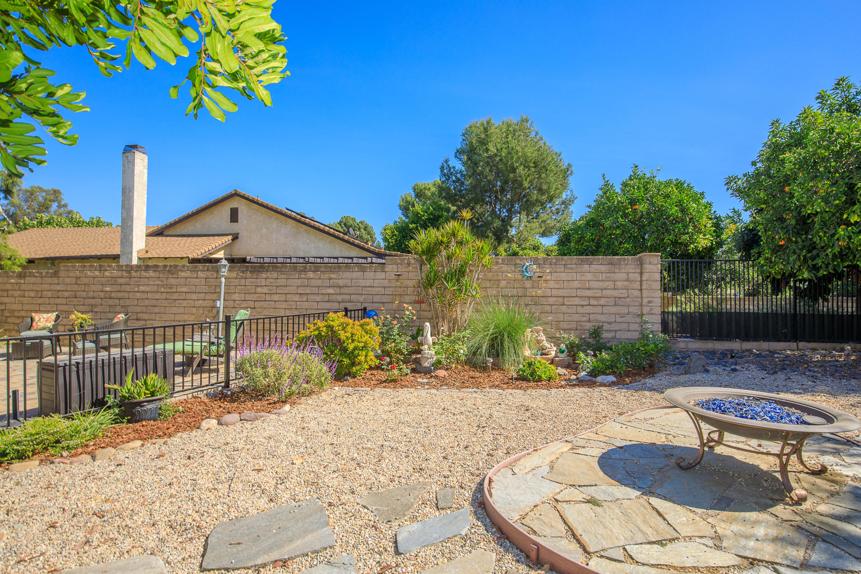 13208 East Quail Summit Road Moorpark, CA 93021 - Photo 30 of 36 a backyard of a house with table and chairs