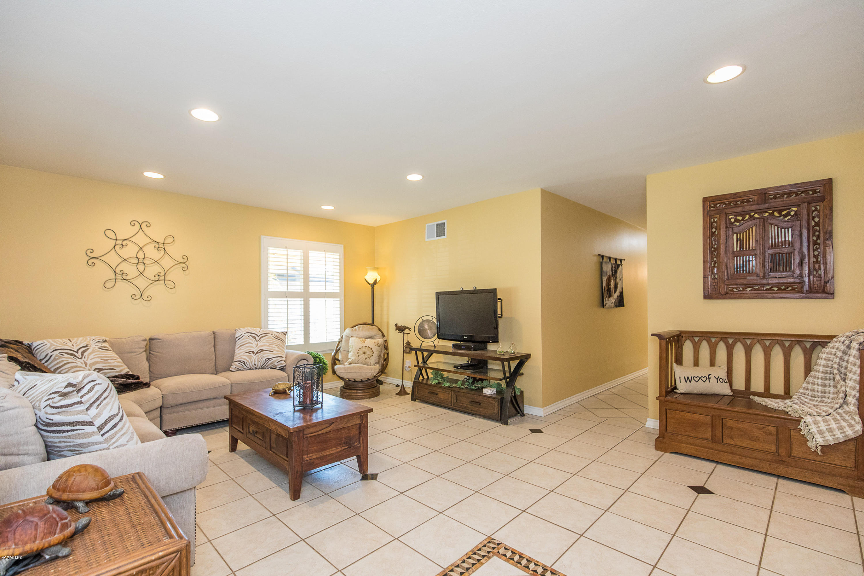 13208 East Quail Summit Road Moorpark, CA 93021 - Photo 4 of 36 a living room with furniture and a flat screen tv