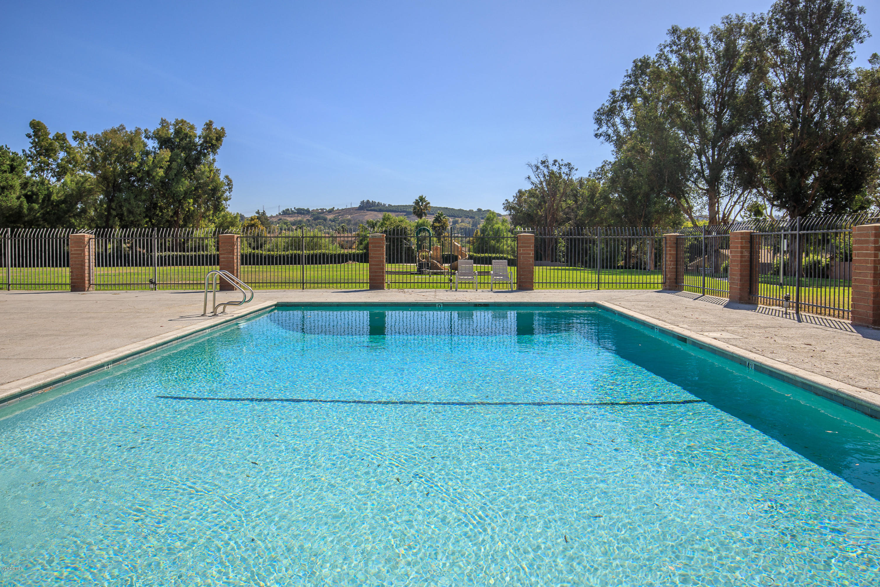13208 East Quail Summit Road Moorpark, CA 93021 - Photo 36 of 36 a view of a swimming pool with an outdoor seating