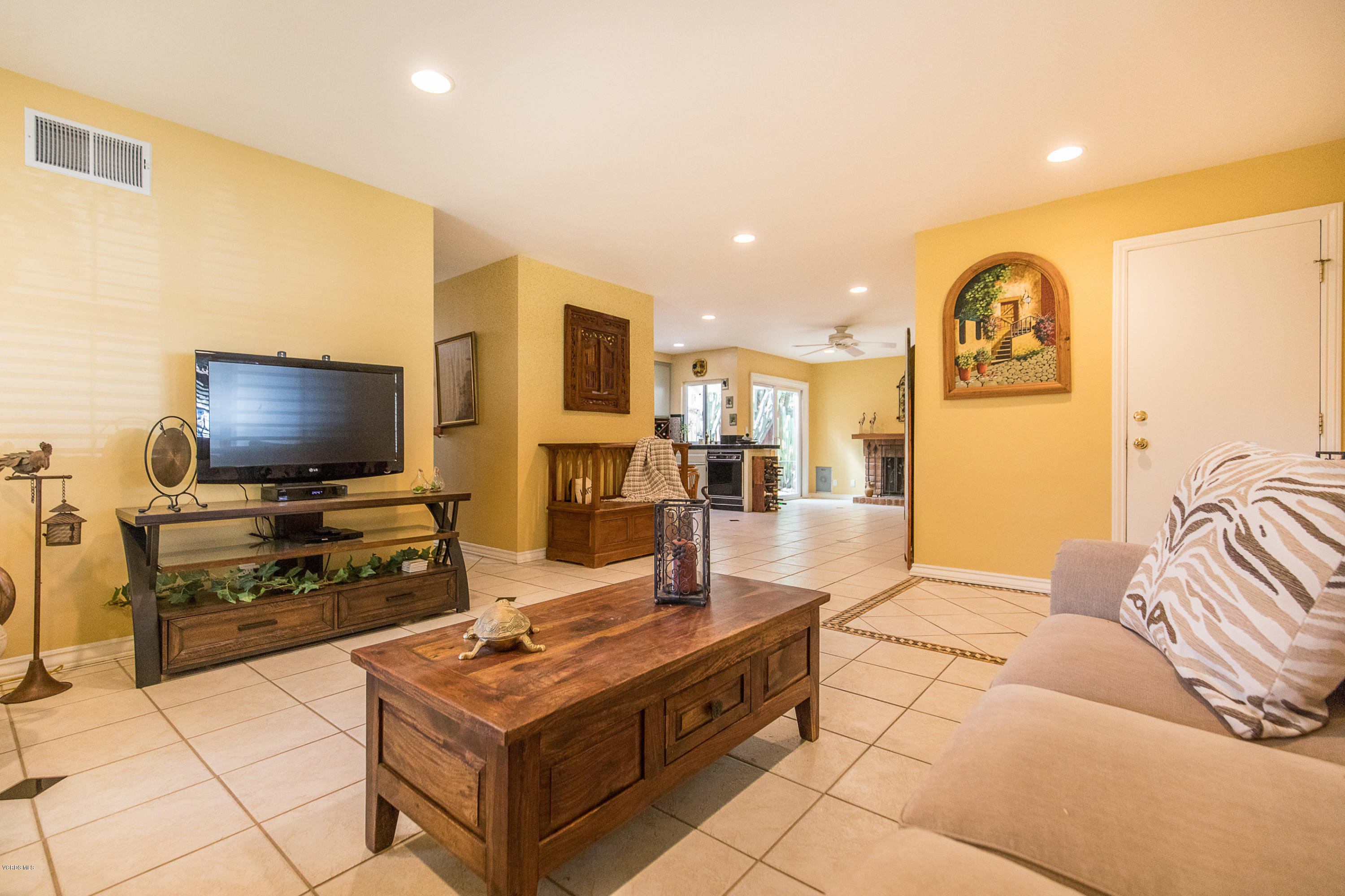13208 East Quail Summit Road Moorpark, CA 93021 - Photo 7 of 36 a living room with furniture and a flat screen tv