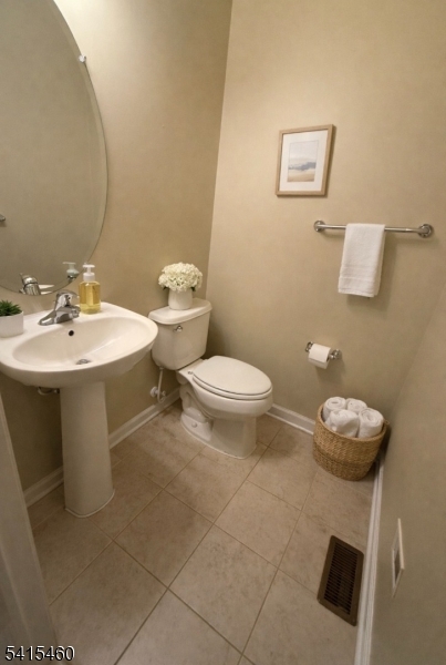 40 Helm's Mill Road Hackettstown, NJ 07840 - Photo 12 of 33 a white toilet sitting next to a bathroom sink