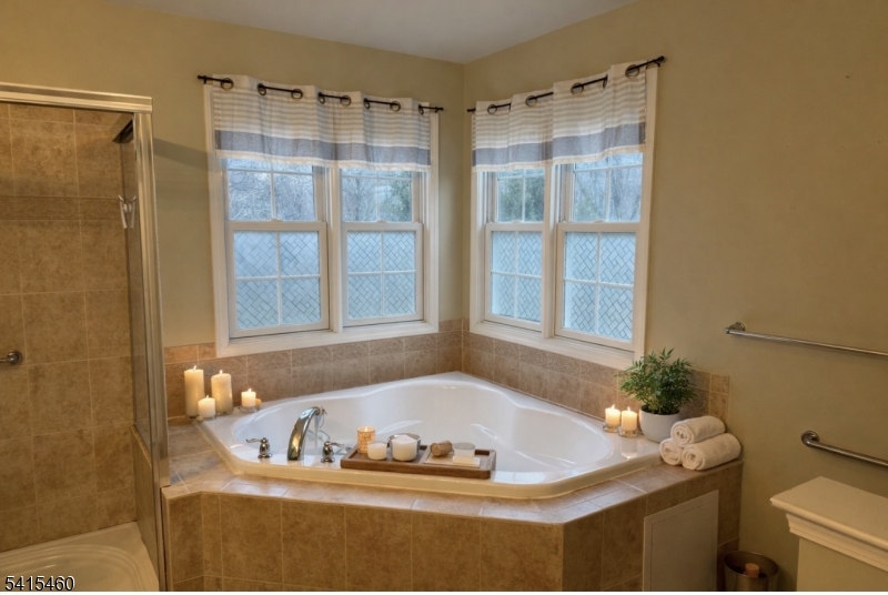40 Helm's Mill Road Hackettstown, NJ 07840 - Photo 15 of 33 a bath tub sitting in a bathroom next to a window