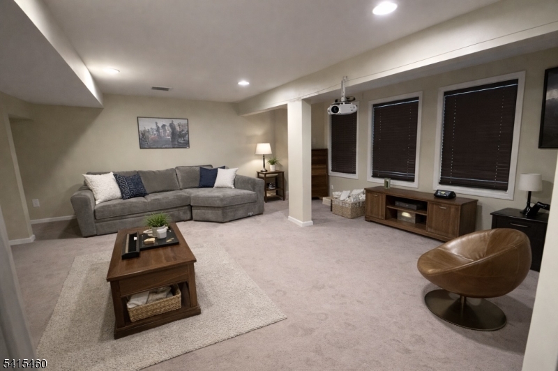 40 Helm's Mill Road Hackettstown, NJ 07840 - Photo 20 of 33 a living room with furniture and a flat screen tv