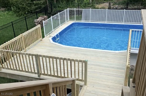 a view of balcony with wooden floor