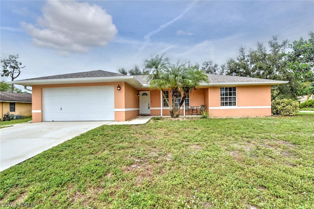 19004 Tangerine Road Fort Myers, FL 33967 - Photo 25 of 26 front view of a house with a yard