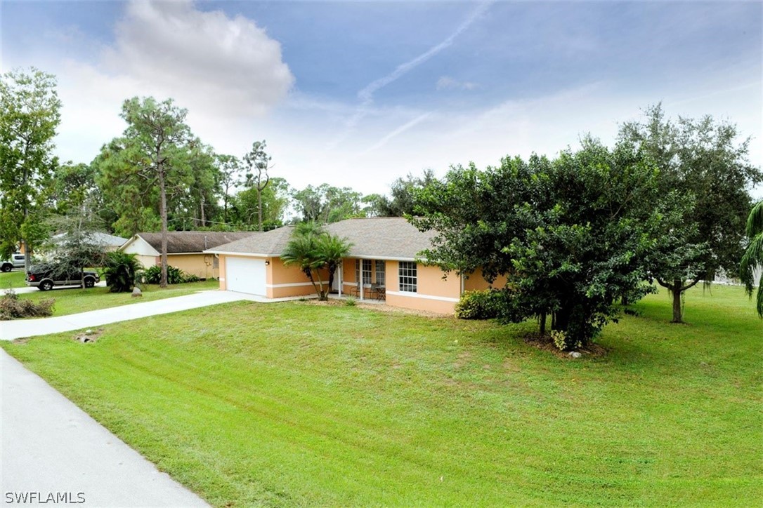 19004 Tangerine Road Fort Myers, FL 33967 - Photo 26 of 26 a front view of a house with a yard
