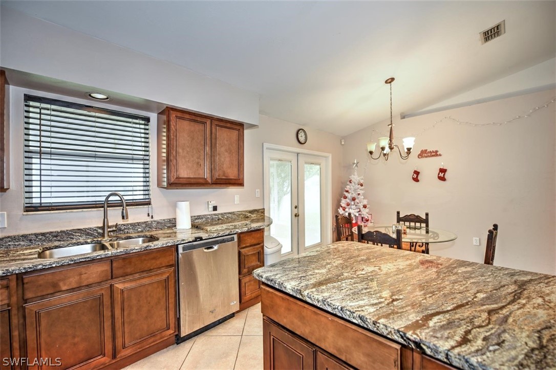 19004 Tangerine Road Fort Myers, FL 33967 - Photo 4 of 26 a kitchen with a sink and a wooden cabinets